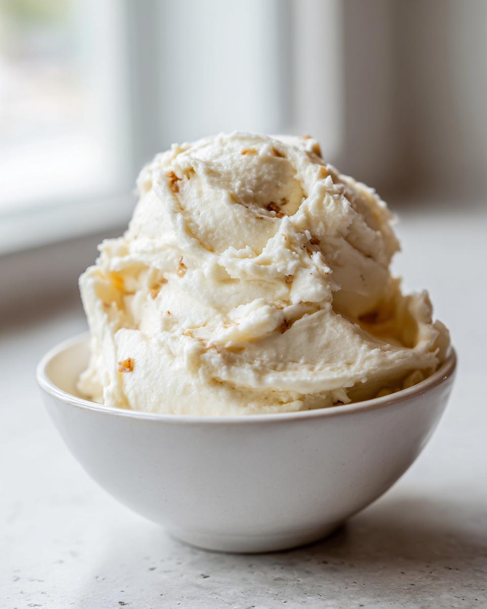 Close-up of creamy garlic mashed potatoes in a white bowl