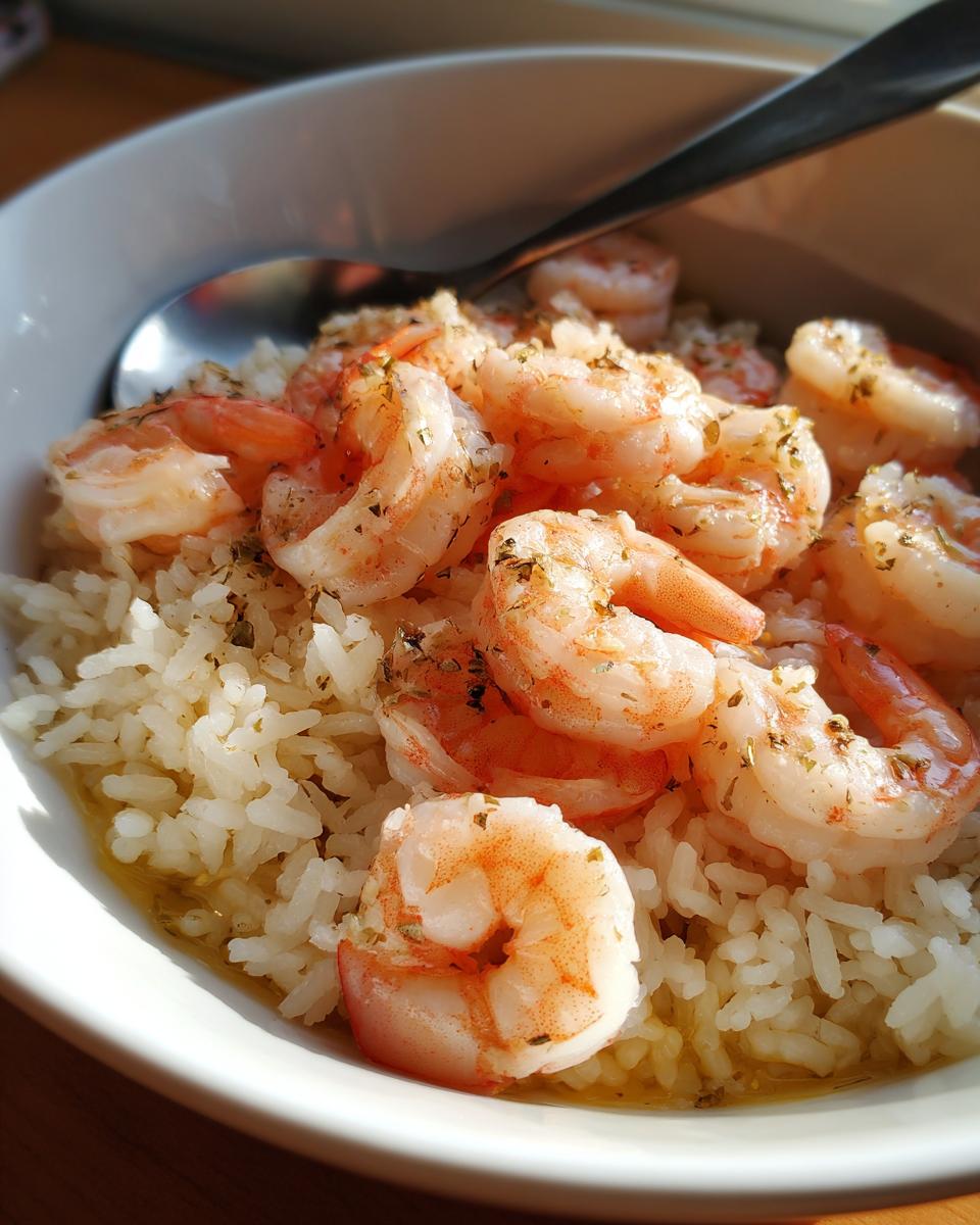 Close-up of shrimp and rice iftar recipes served in a white bowl with herbs and seasoning