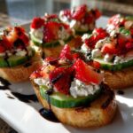 Fresh spring appetizers with toasted bread, cucumber slices, cottage cheese, strawberries, and balsamic glaze
