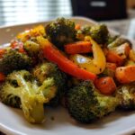 Plate of roasted broccoli, carrots, and bell peppers as a vegetable side dish recipes example